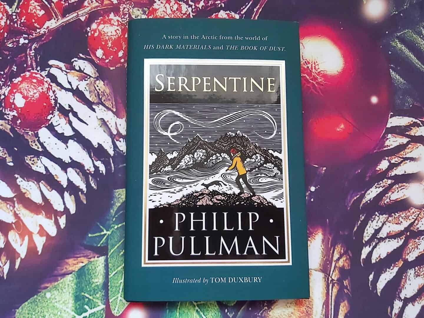Serpentine by Phillip Pullman small book against Christmas background