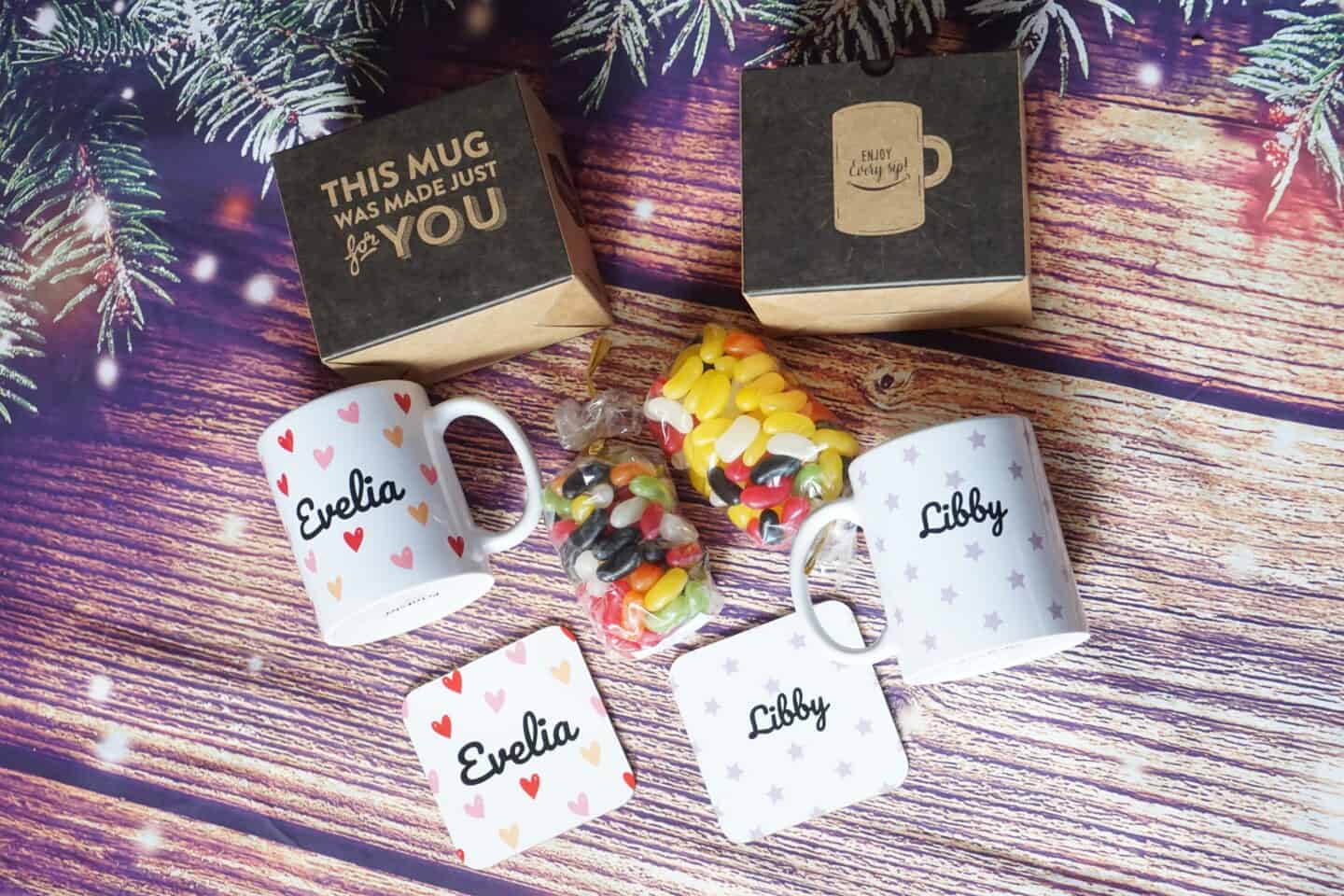 Two personalised mugs and coasters from Printster with the names Libby and Evelia with presentation gift box and sweets