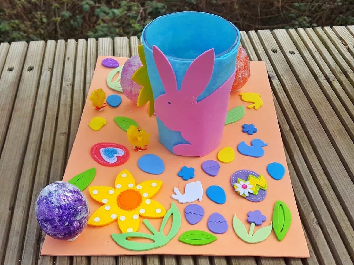 Craft for children - an easy Easter table decoration. This is a great craft for kids to get involved with. There are simple bits for them to do such as fixing stickers on, while you can get on with the more complicated bits like glueing and sticking. This craft incorporates nature and allows you to bring a little bit of Spring into your home this Easter.