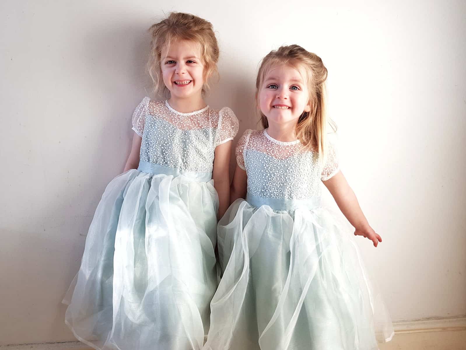 two little girls in mint green flower girl dresses