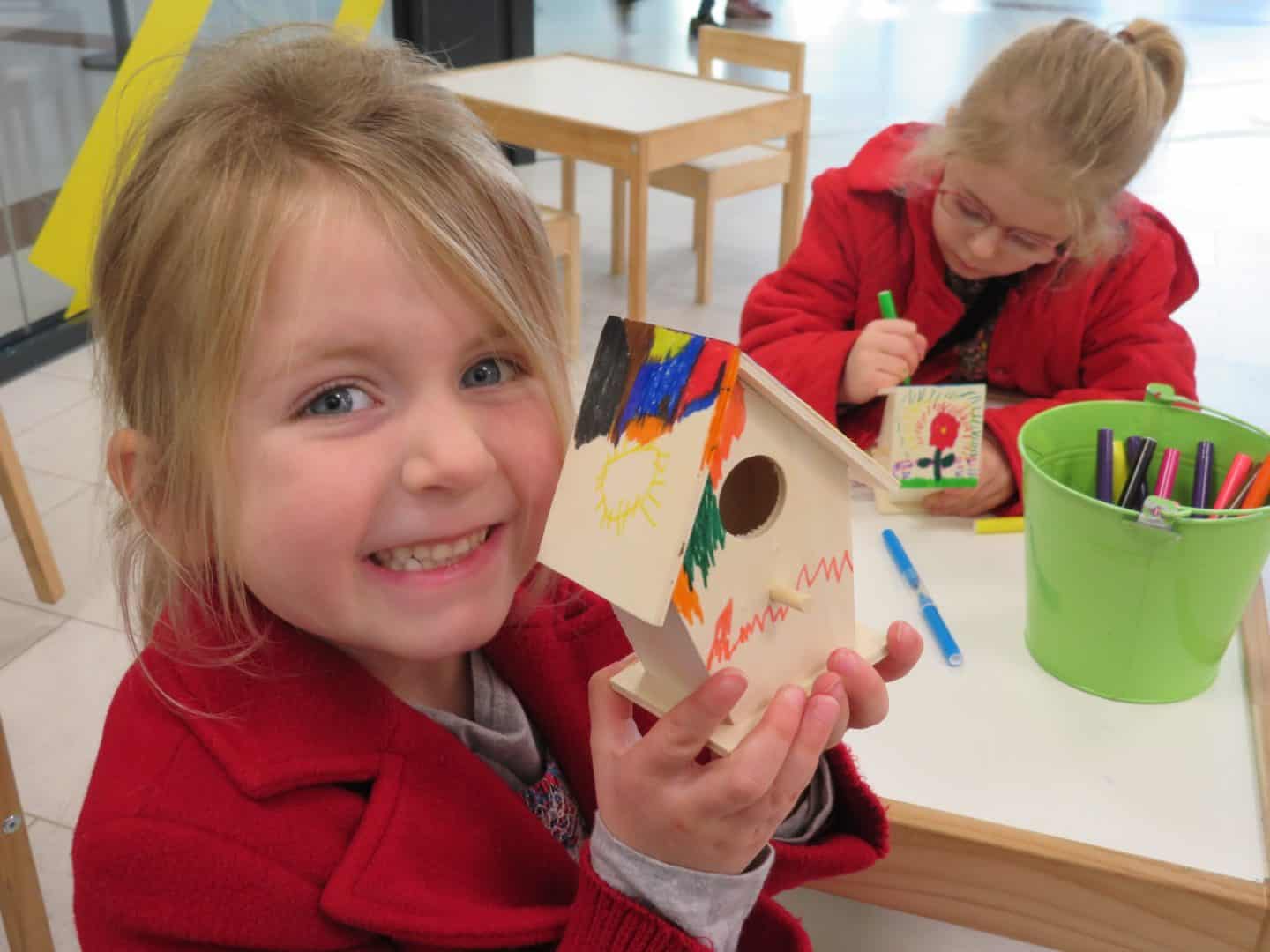 Crowngate Shopping Centre Worcester kids club smiling girl with bird house