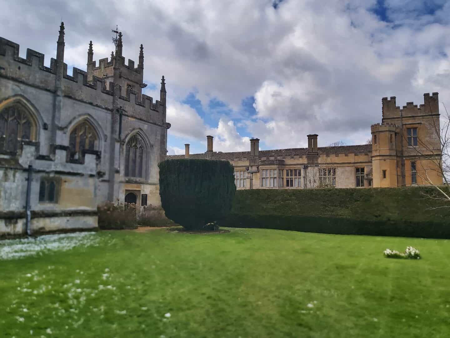 St Mary's Church in Sudeley Castle Gardens with the castle in the background