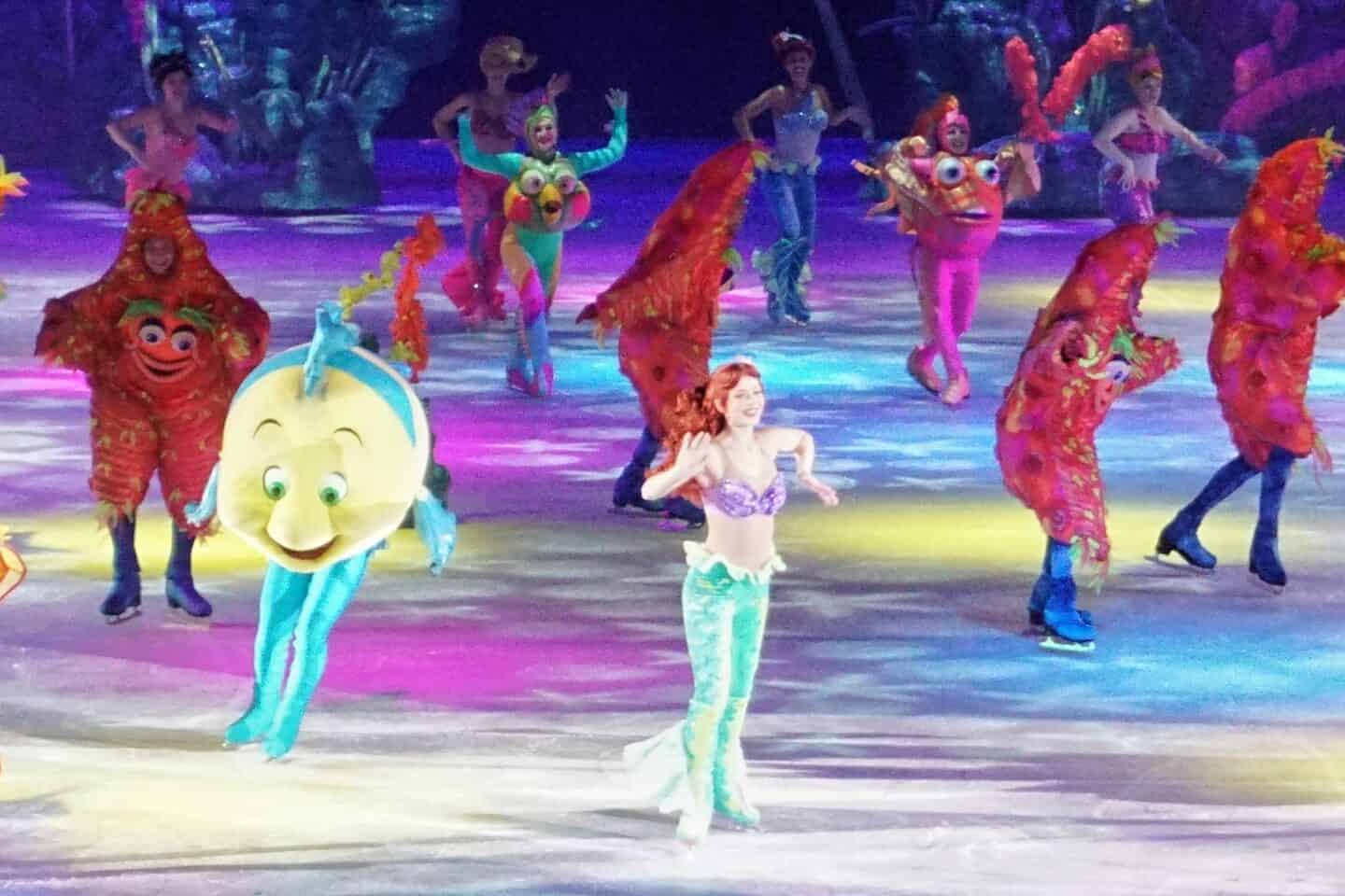 Ariel and her friend Flounder dancing in Disney on Ice Find Your Hero