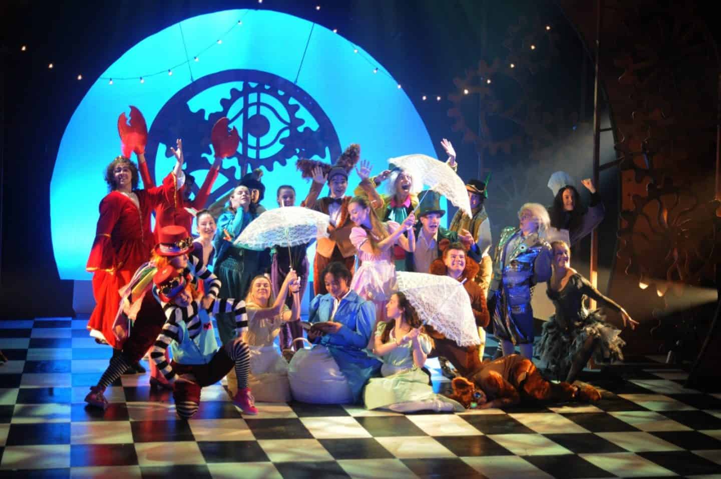 Cast on stage in Alice in Wonderland at The Old Rep Theatre