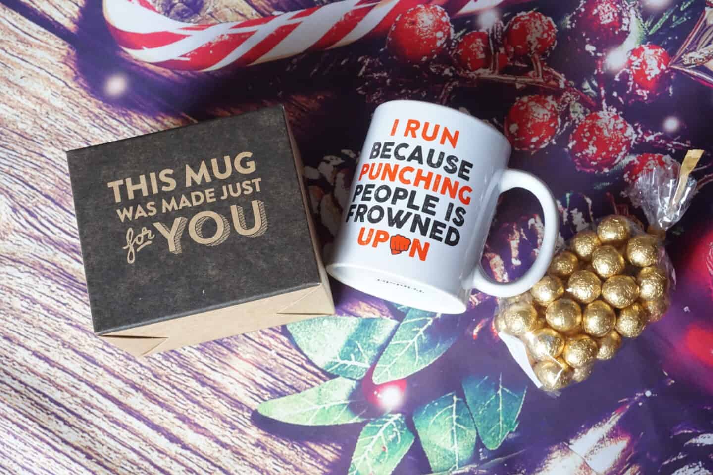 Christmas gift for a runner - mug with the words "I run because punching people is frowned upon" with gift box and chocolates