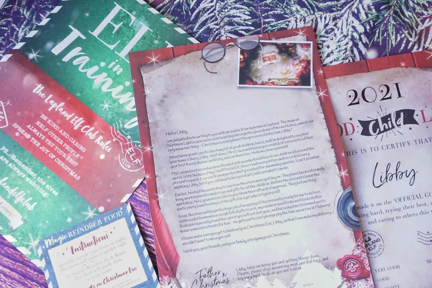 Letter from Santa addressed to Libby displayed with other Lapland Letters papers