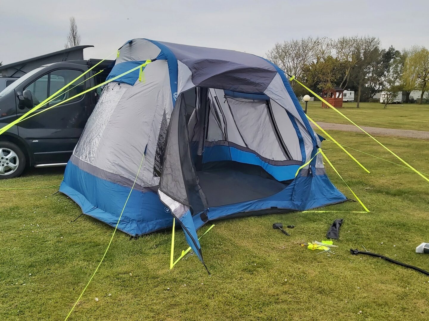 In the process of putting up the Olpro Cubo Breeze Inflatable Camper Van Drive Away Awning 