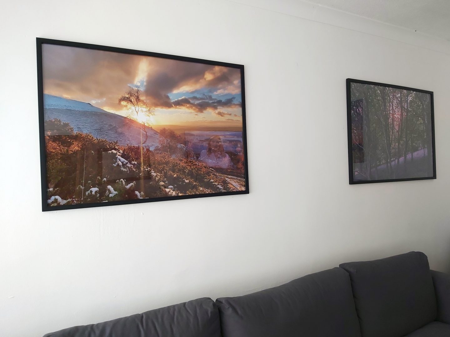 Two large framed photos hanging on a white wall to demonstrate how you can Print and Frame Photos Online