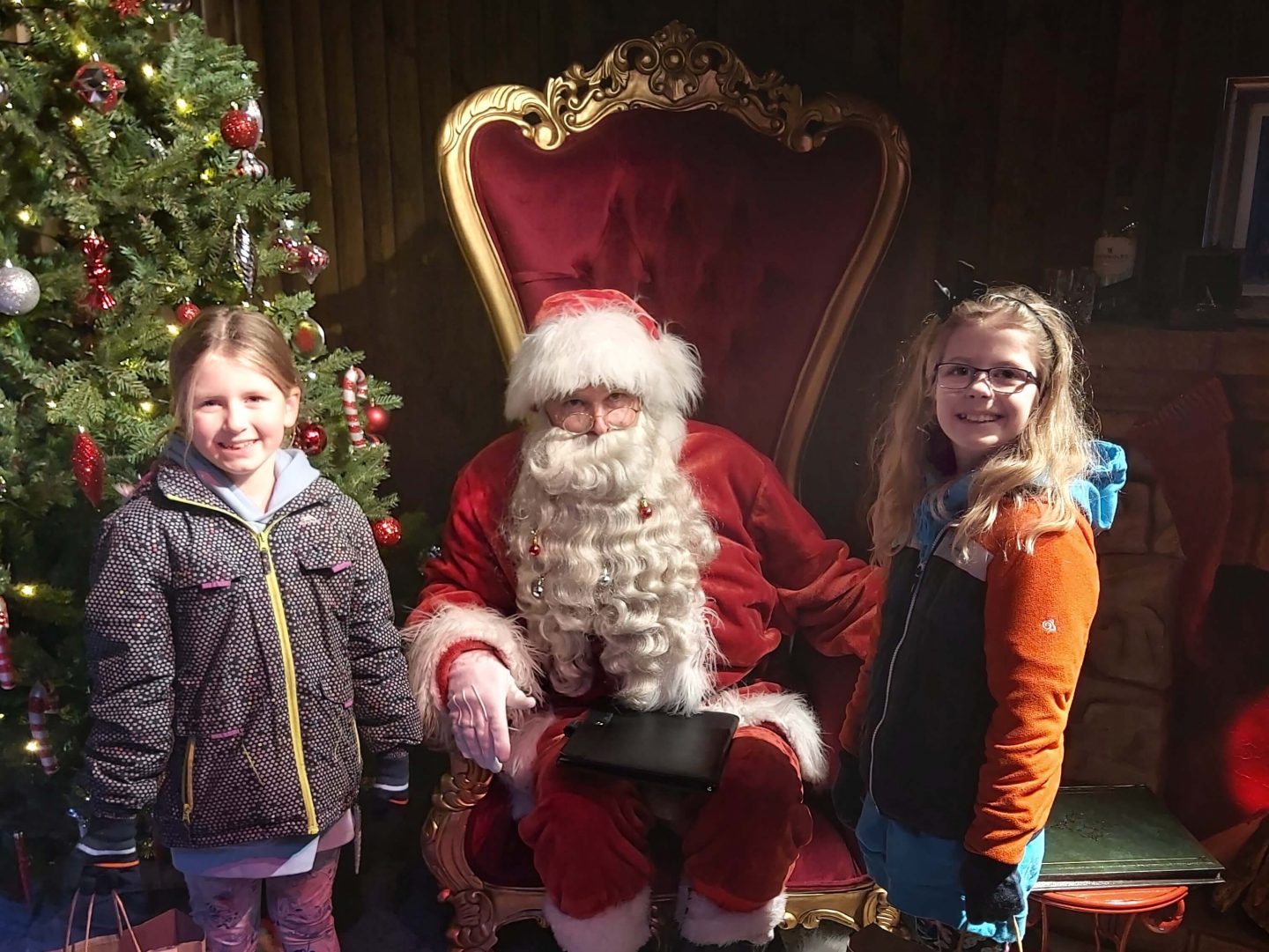 Two girls meeting Santa at Winter Glow