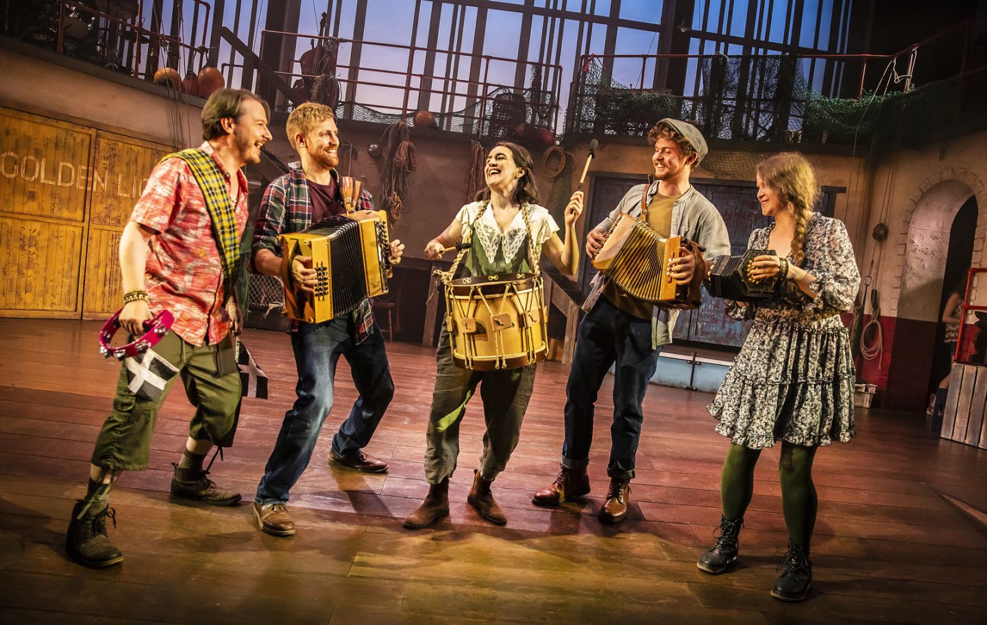 Fishermans Friends the Musical at Malvern theatres review photo of the musicians in the cast standing in a semi-circle playing their instruments