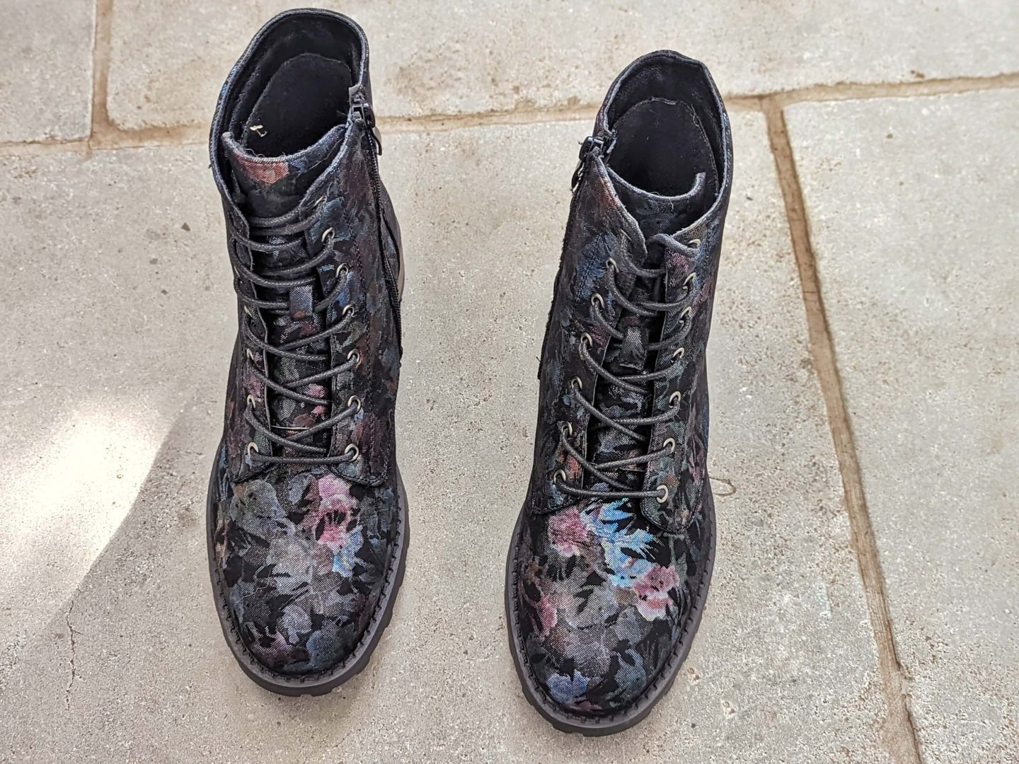 Cotton Traders floral lace-up boots on a grey tiled floor