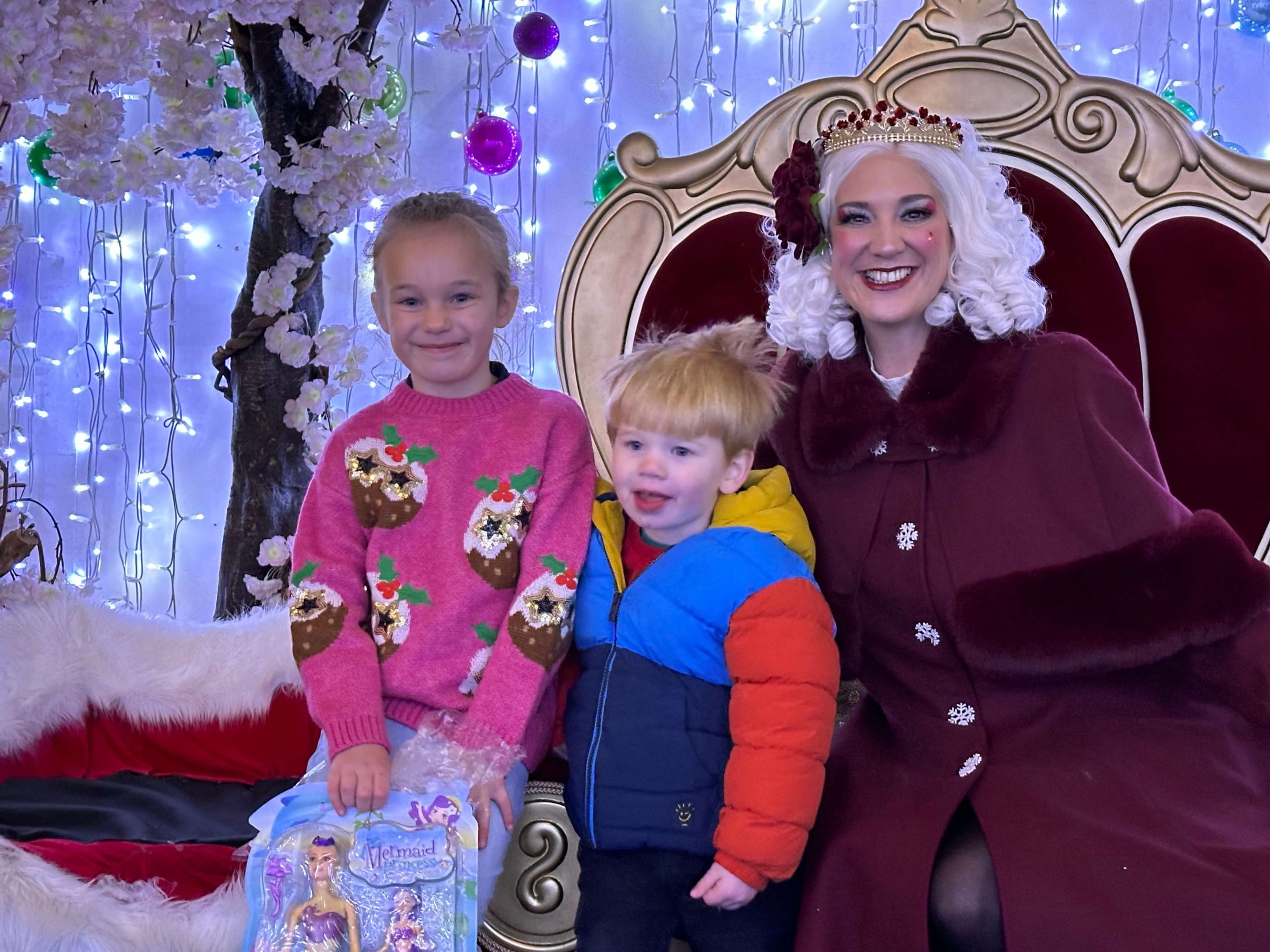 Two children meeting Mrs Claus at the Magical Christmas Adventure
