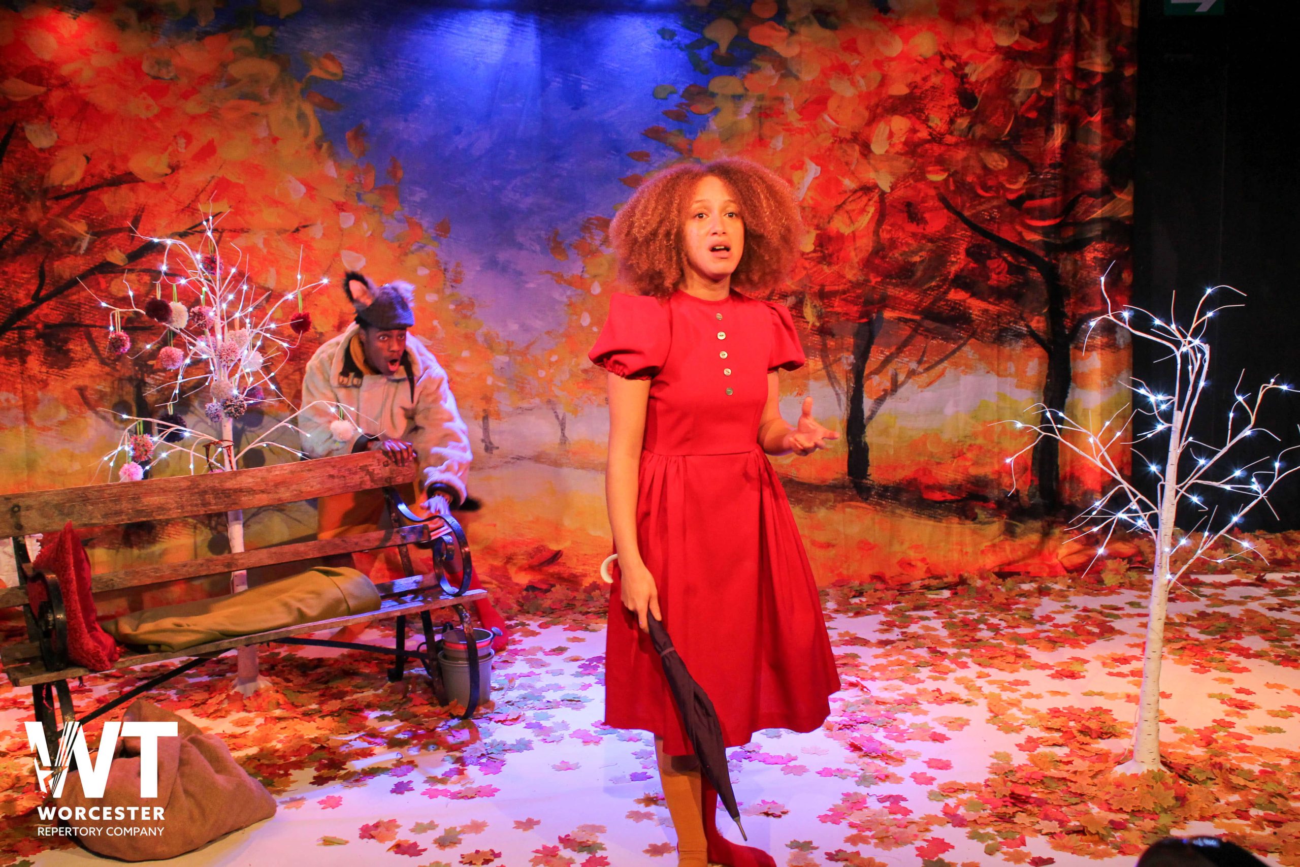 Little Red Riding Hood on stage at The Swan Theatre Worcester with autumnal colours in the set