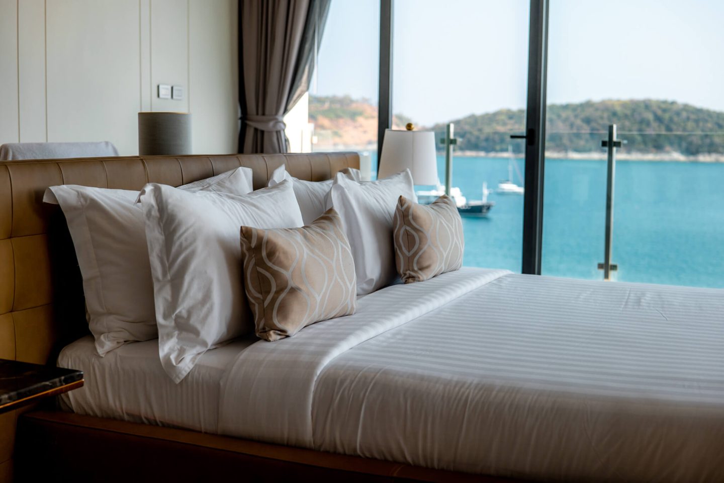 Inspiring Villas sea view villa taken from the bedroom with bed beside window overlooking the sea