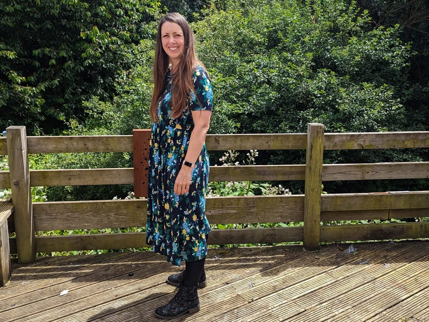 Natalie wearing a black and flowery dress