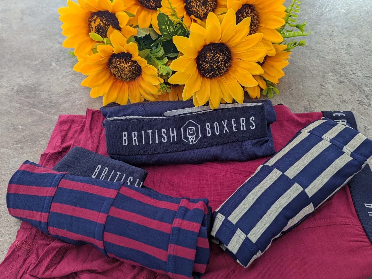 British Boxers men's trunks in hoopla design displayed with sunflowers