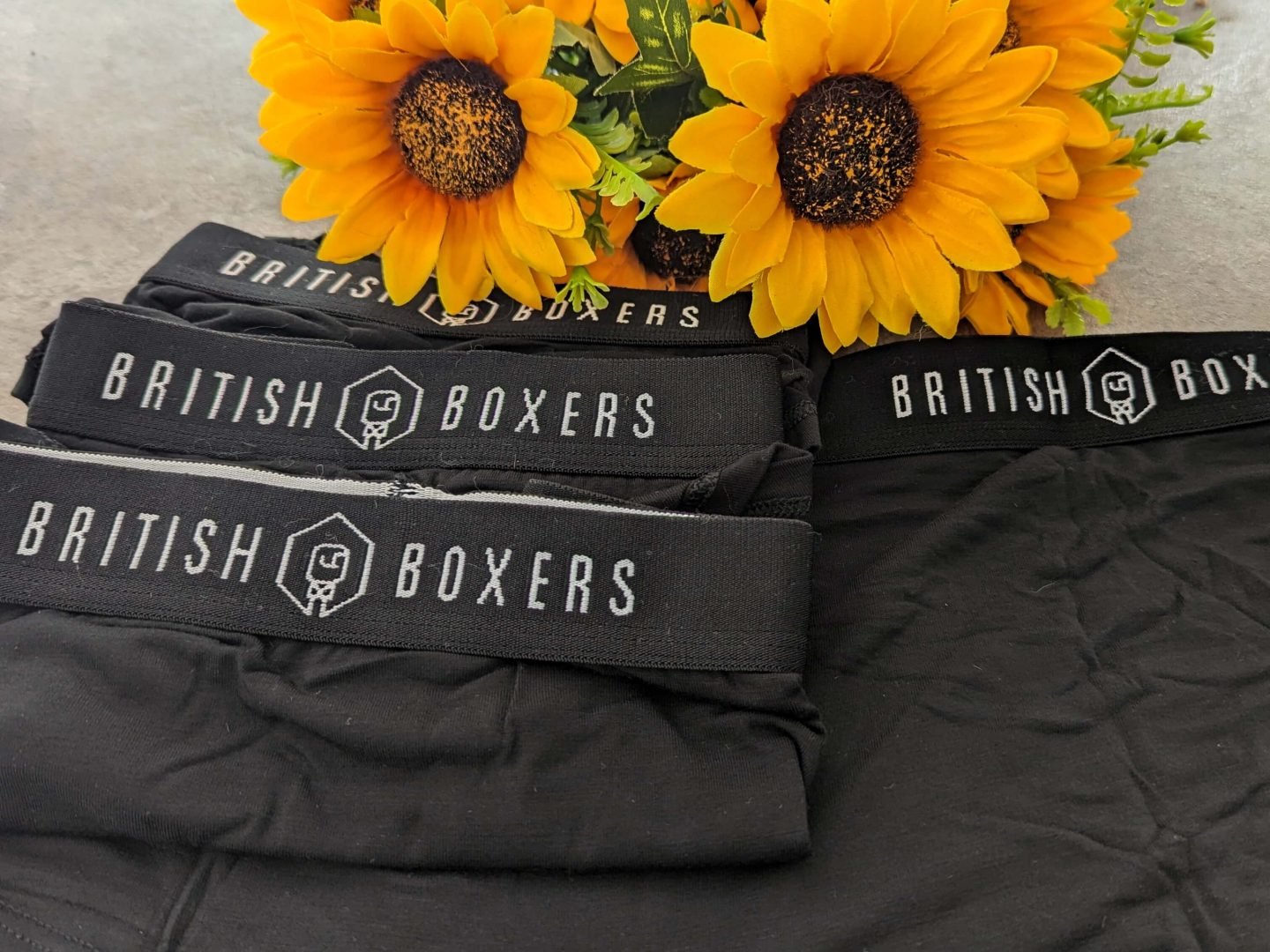 British Boxers women's briefs in black displayed with sunflowers