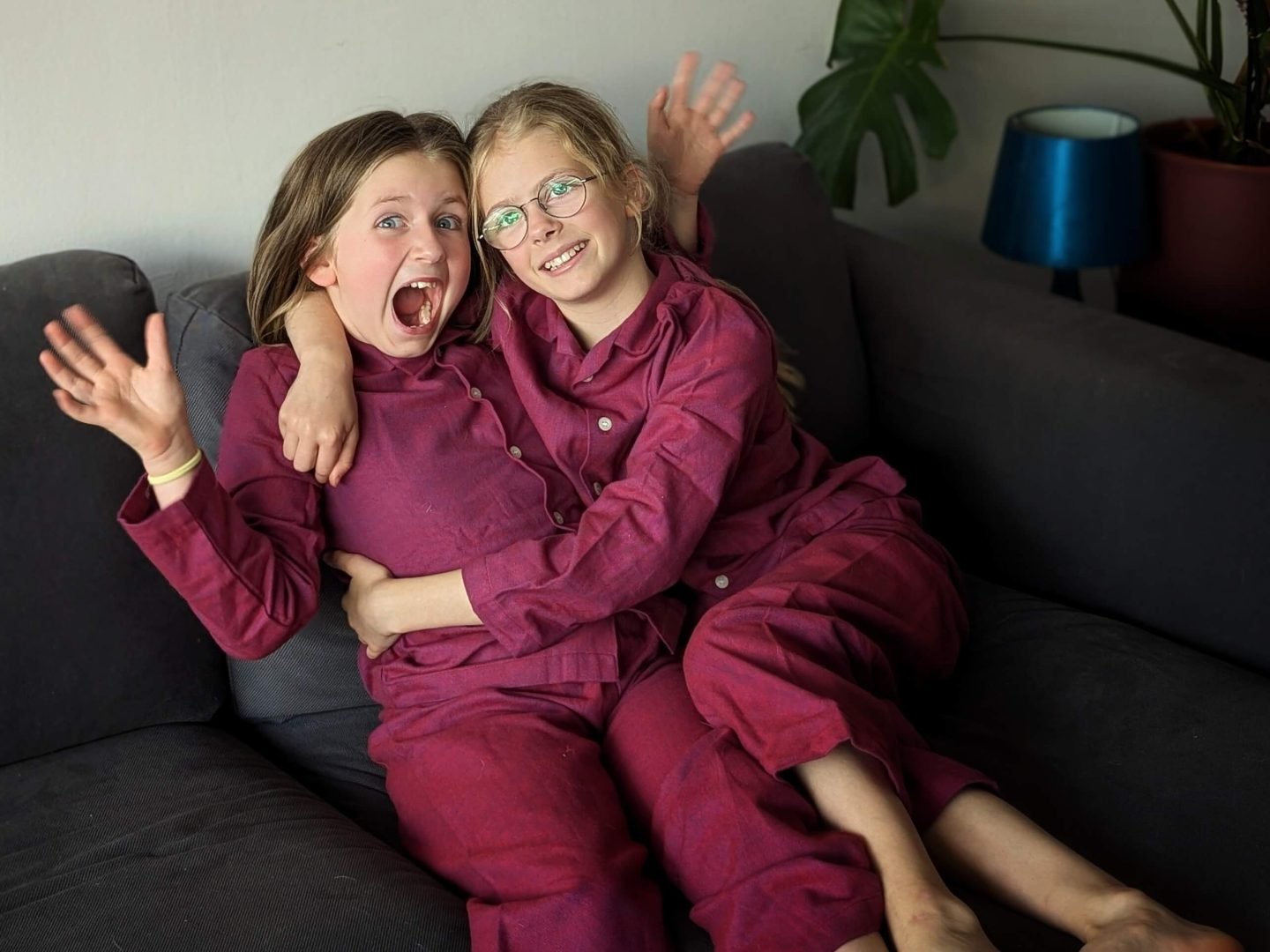 Two children in British Boxers rioja coloured pyjamas