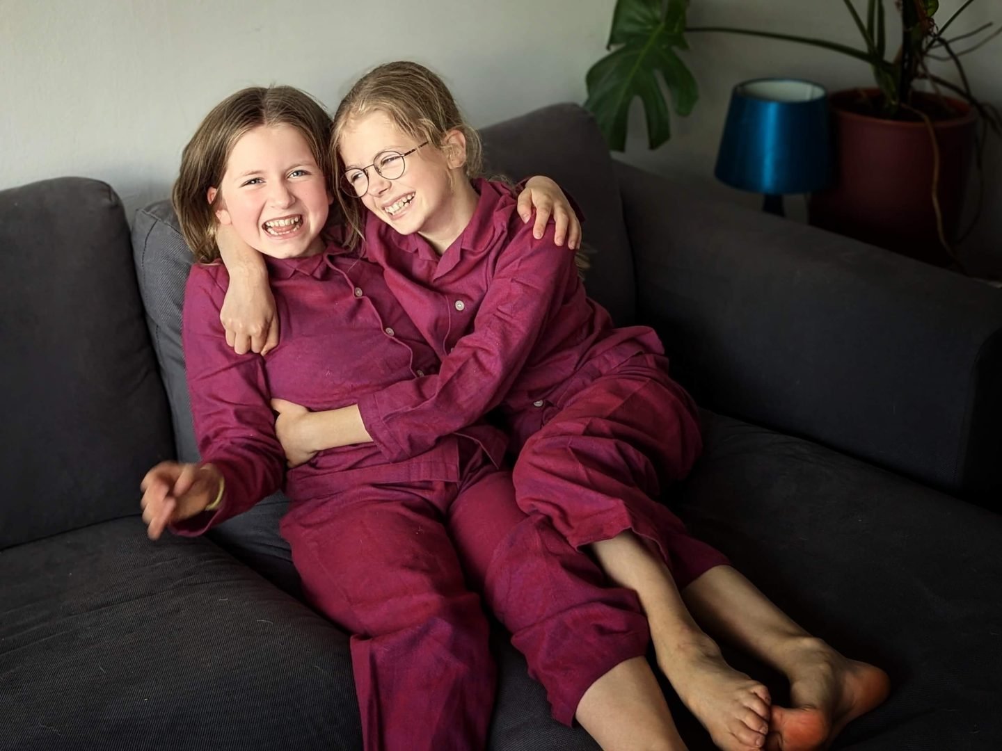 Two children in British Boxers rioja coloured pyjamas