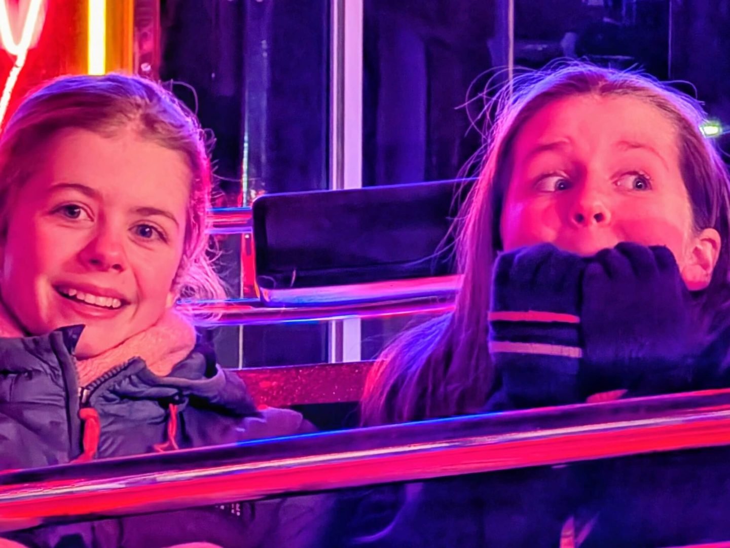 Close up of Libby & Lia on the waltzer fairground ride at Winter Glow Malvern Worcestershire 2025