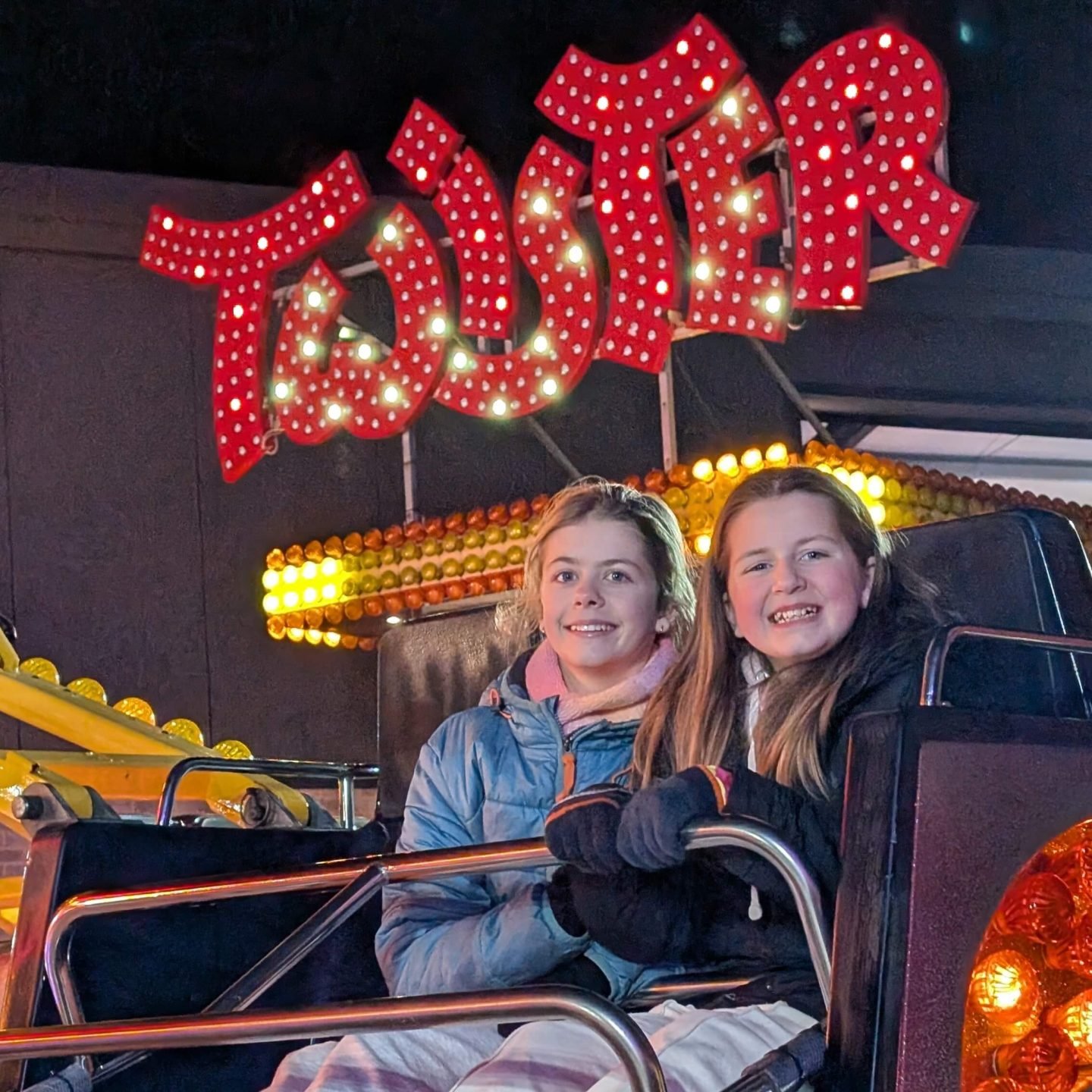 Libby & Lia on the twister ride at Winter Glow Malvern Worcestershire 2025
