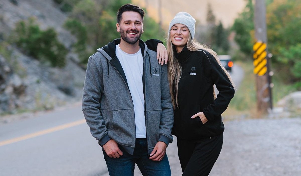Cheerful couple standing on mountain roads