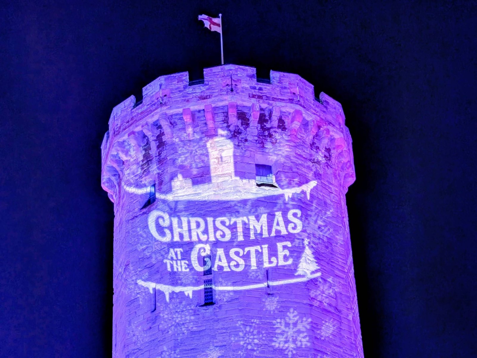 A turret at Warwick Castle lit up for Christmas at the Castle