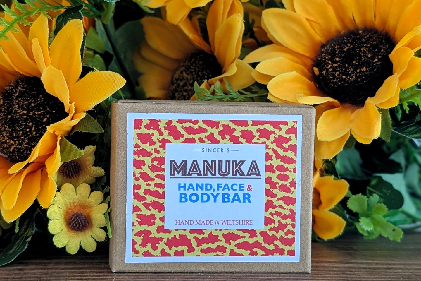 SINCERIS handmade range - Manuka Honey soap bar displayed against sunflowers