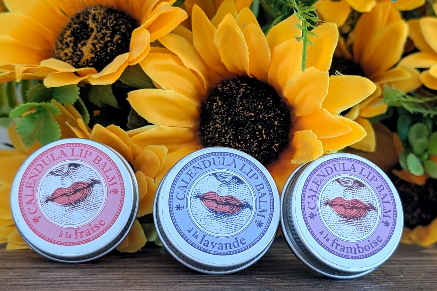 SINCERIS handmade range - lip balms displayed against sunflowers