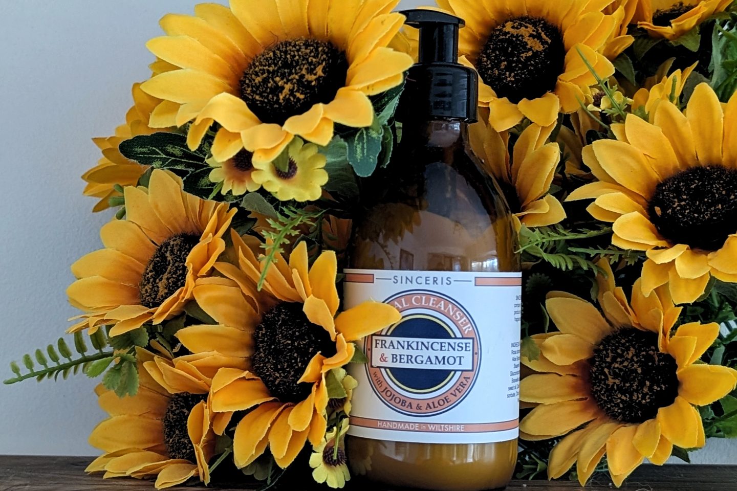 SINCERIS handmade range - facial cleanser displayed against sunflowers