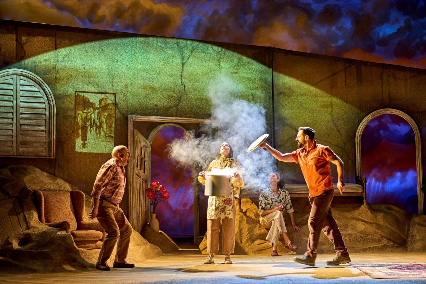 Beekeeper of Aleppo cast on stage with a cooking pot