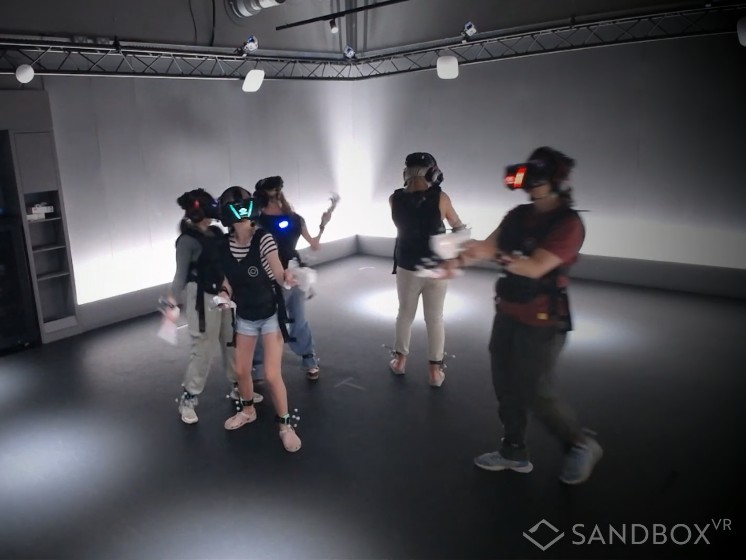 Group of 5 females two adults and three teenagers in the VR room at Sandbox Birmingham Grand Central