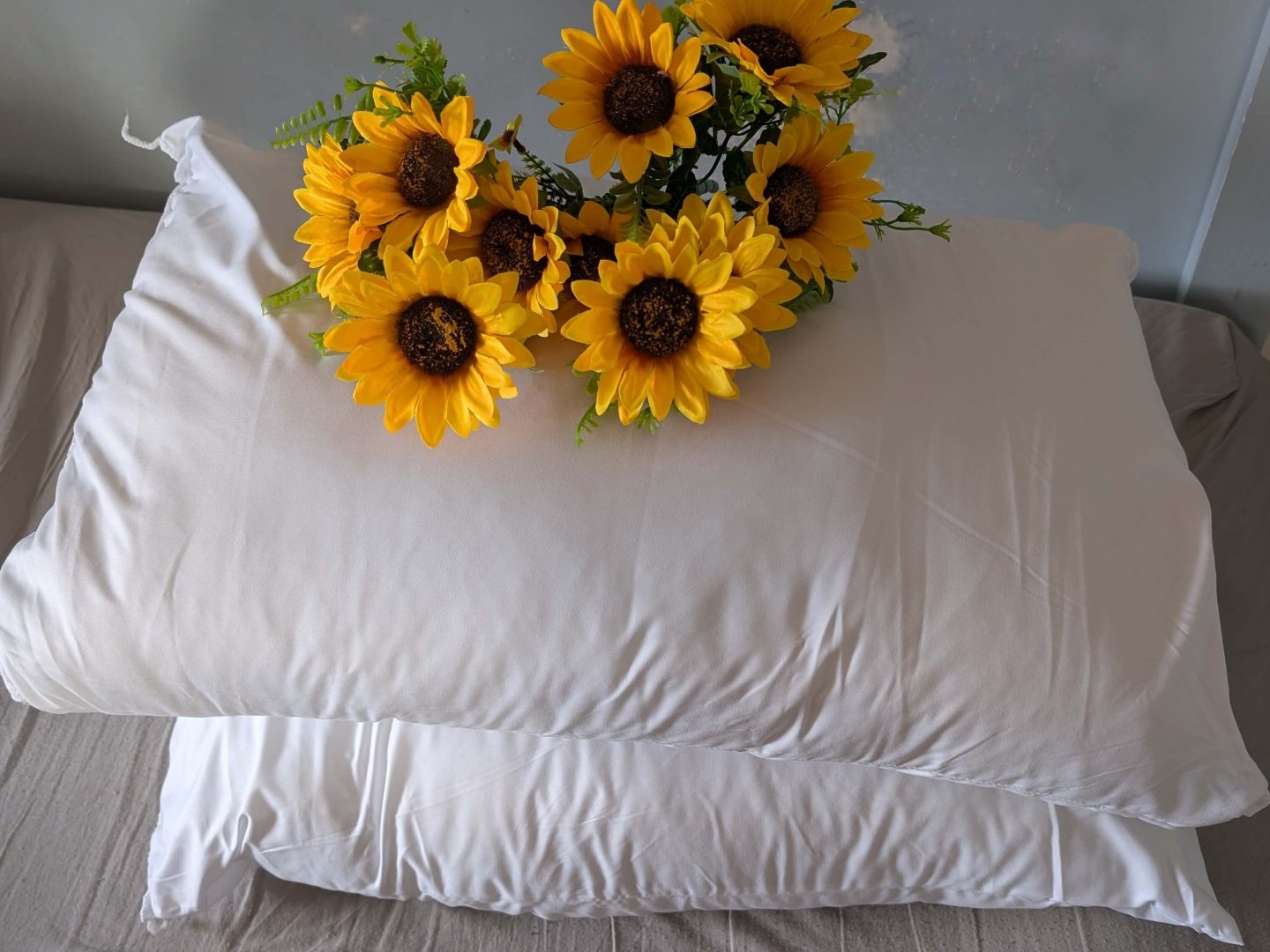 Sunflowers on a white pillow