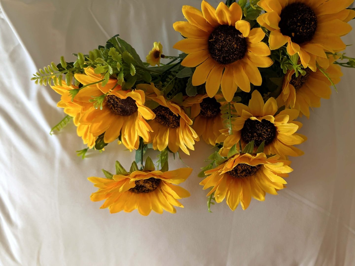 Sunflowers on a white pillow